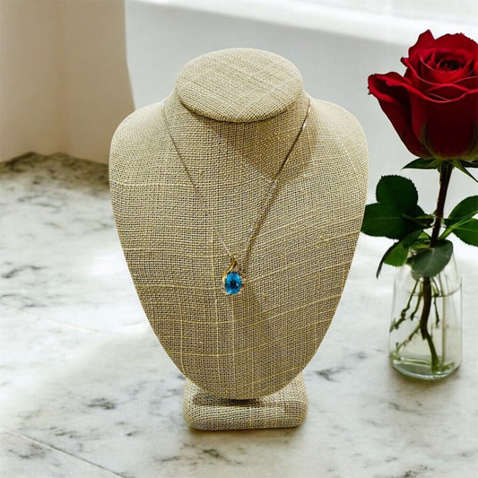 SS/10KT YG OVAL BLUE TOPAZ PENDANT ON 18" BOX CHAIN