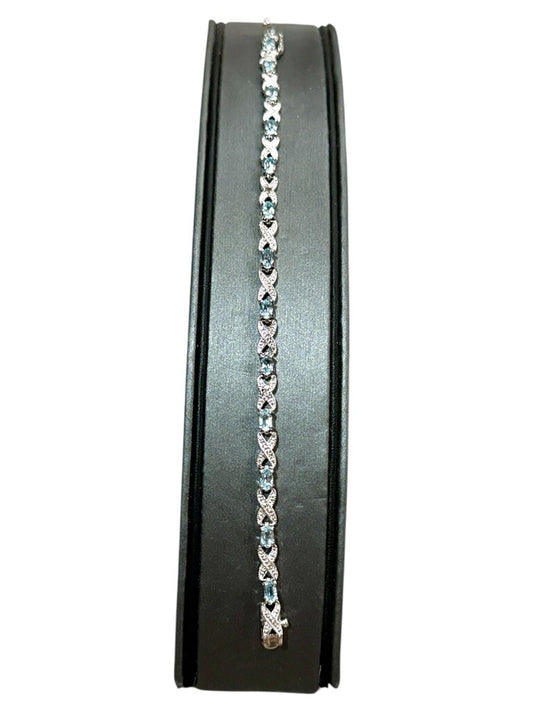 SS OVAL BLUE TOPAZ TENNIS BRACELET