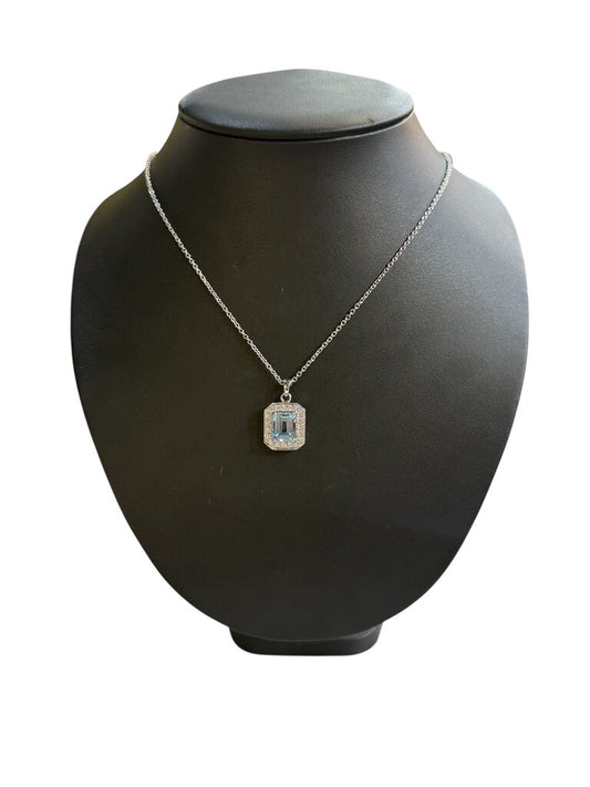 SS EMERALD CUT BLUE TOPAZ W/WHT SAPPHIRE HALO PENDANT ON CHAIN