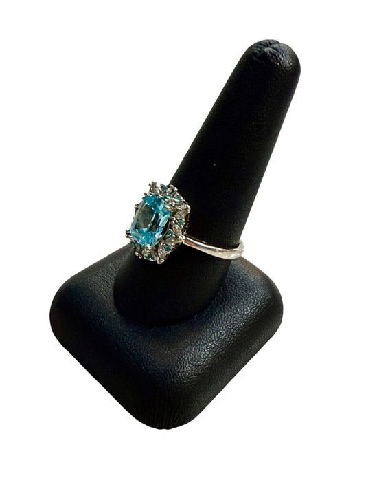 SS EMERALD CUT BLUE TOPAZ CTR W/WHT SAPHIRE HALO RING SZ 8