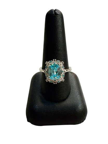 SS EMERALD CUT BLUE TOPAZ CTR W/WHT SAPHIRE HALO RING SZ 8