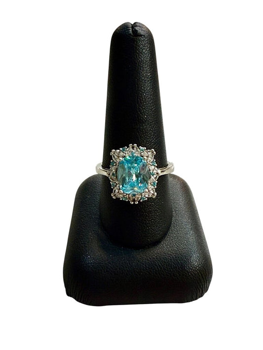SS EMERALD CUT BLUE TOPAZ CTR W/WHT SAPHIRE HALO RING SZ 8