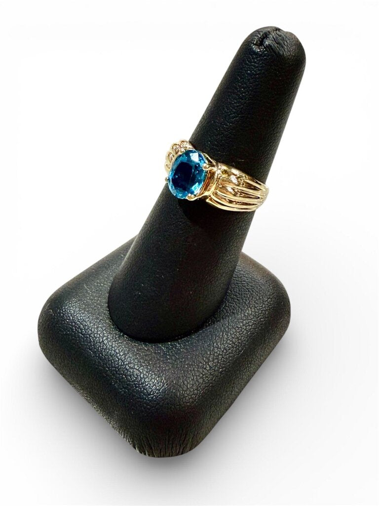 10KT YG OVAL BLUE TOPAZ SHELL LIKE BAND SZ 7