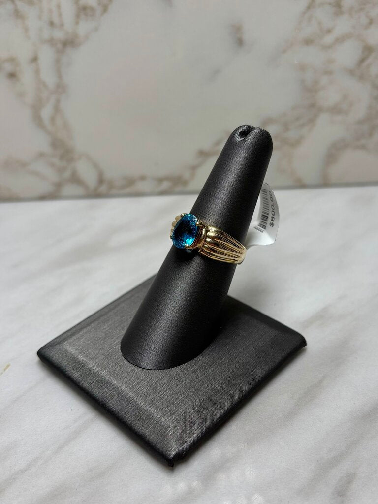 10KT YG OVAL BLUE TOPAZ SHELL LIKE BAND SZ 7